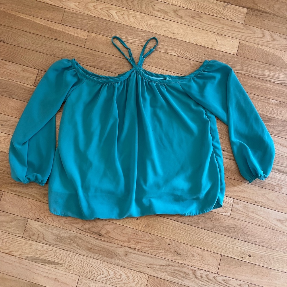 Beautiful off the shoulder top with straps at neck.